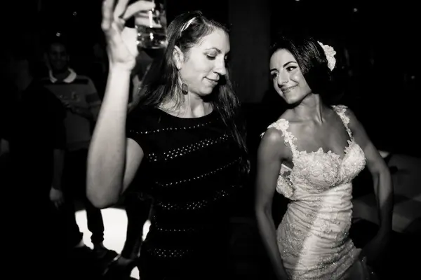 Bride and guest dancing at Washington wedding reception. Lovely Events.