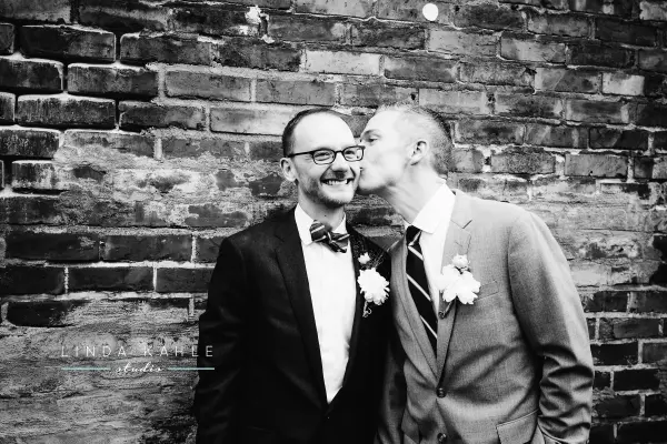 Two grooms sharing a moment at Washington LGBTQ wedding. Lovely Events.
